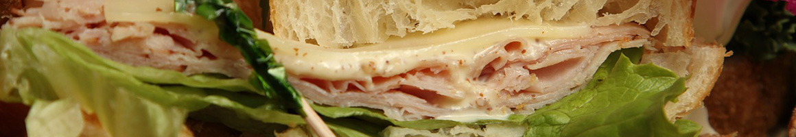 Eating Deli Sandwich at Fortuna's Deli & Caterers restaurant in Westport, CT.